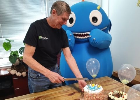 LiteracyPlanet turns 12 blog - cutting cake